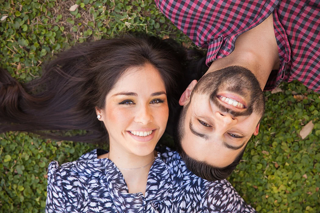Couple laying down in the grass